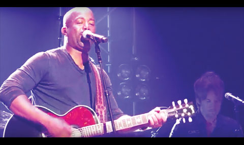 Darius Rucker with guitar singing Don't Think I Don't Think About It